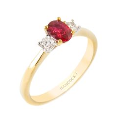 oval ruby and diamond three stone ring