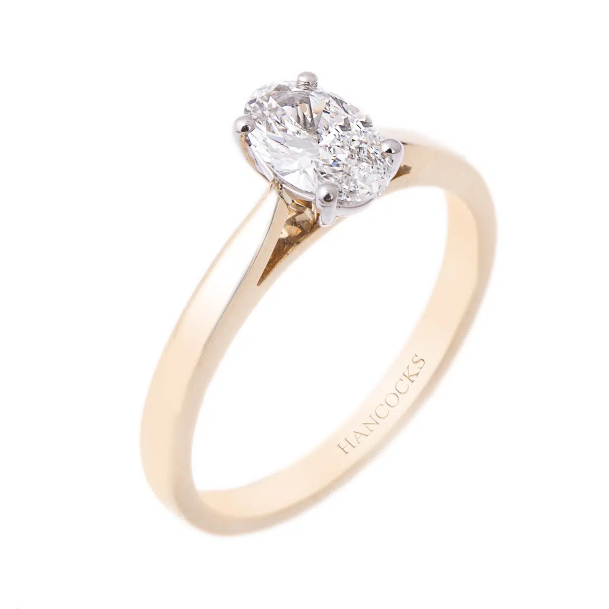 Oval cut diamond ring on yellow gold
