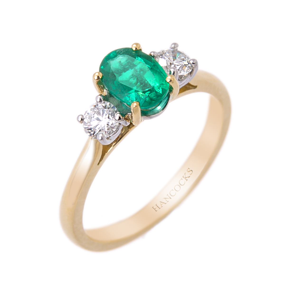 emerald and diamond 3-stone ring in gold