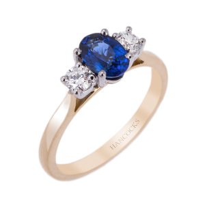 sapphire and diamond three stone ring in yellow gold
