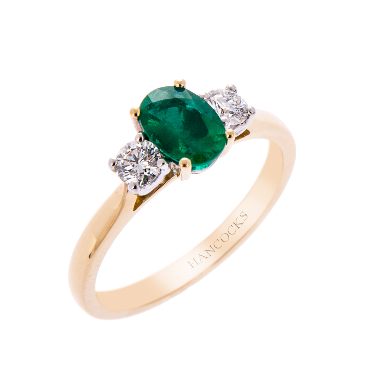 emerald and diamond 3-stone ring in gold