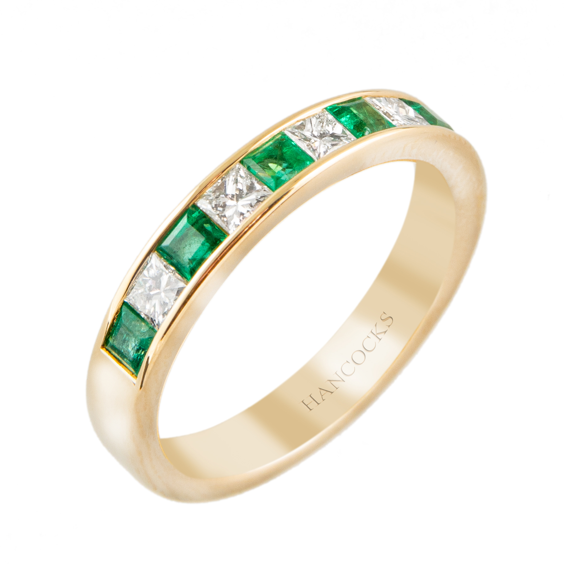 emerald and princess cut diamond eternity ring in gold