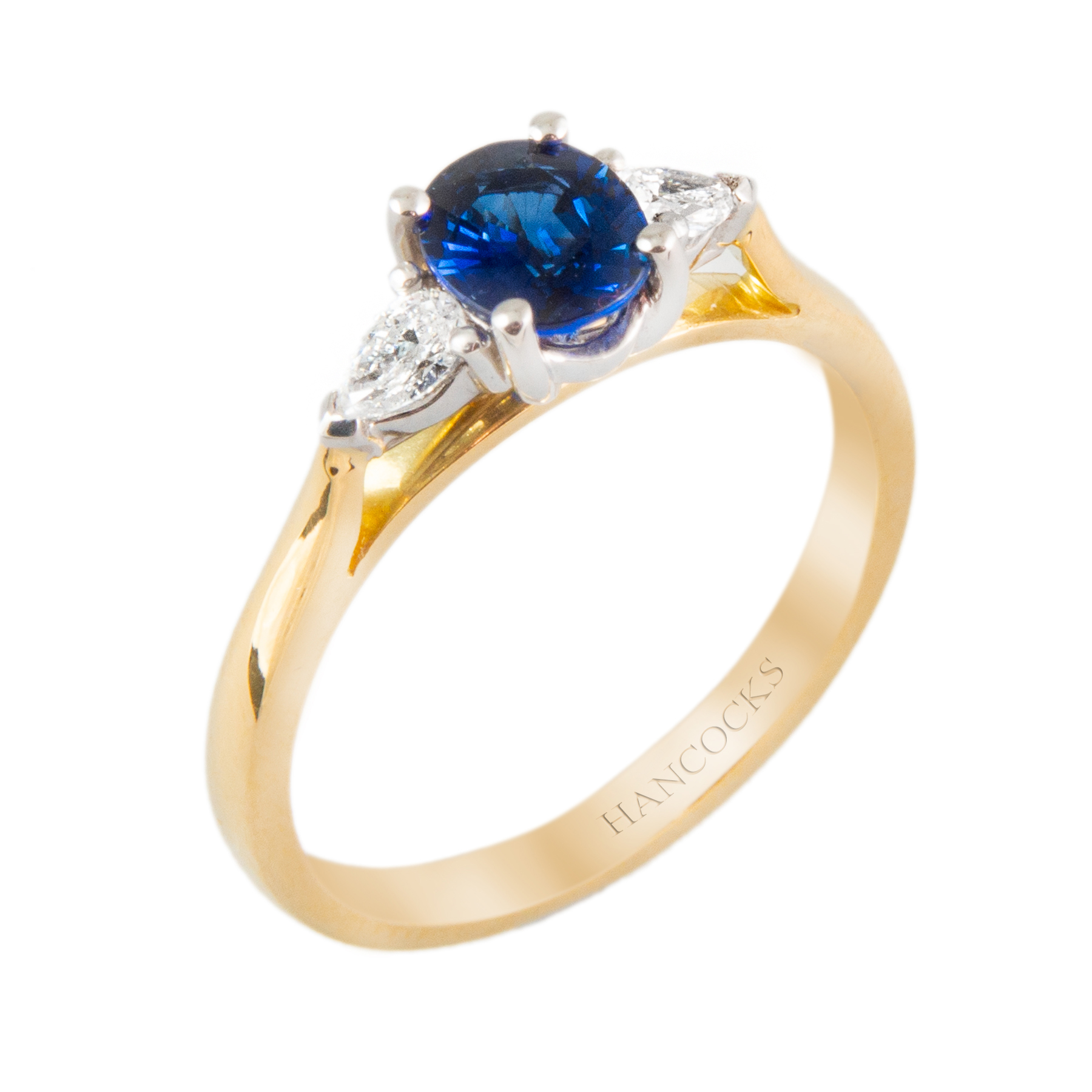 sapphire and diamond three stone ring with pear cuts