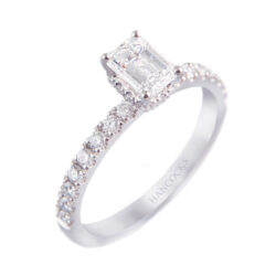 platinum emerald cut diamond ring with diamond shoulders