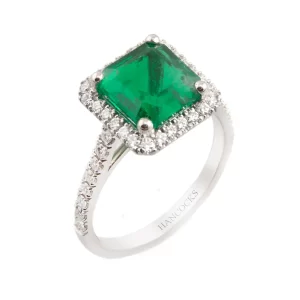 halo emerald and diamond cluster engagement ring
