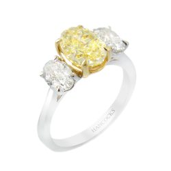 oval yellow diamond three stone ring