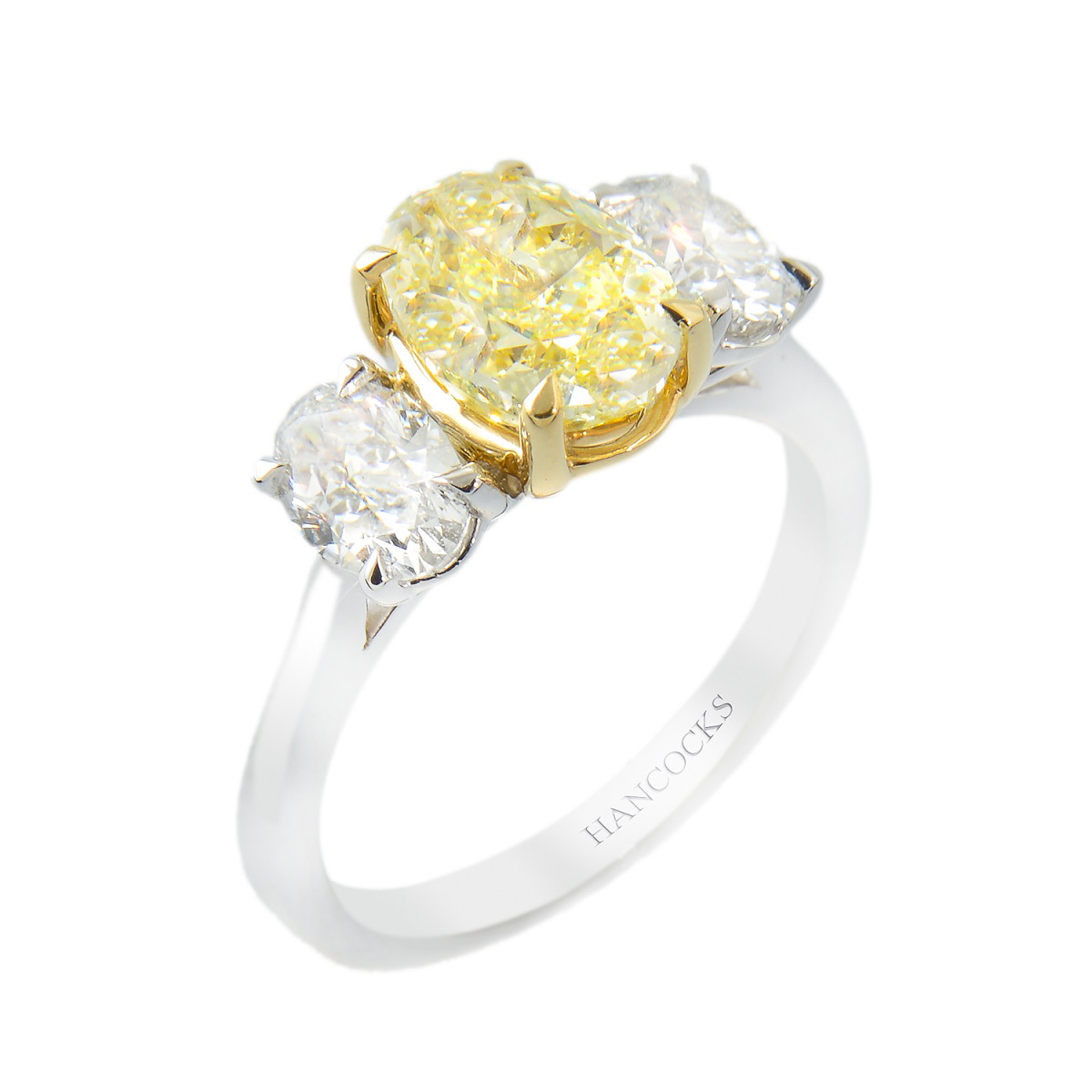oval yellow diamond three stone ring