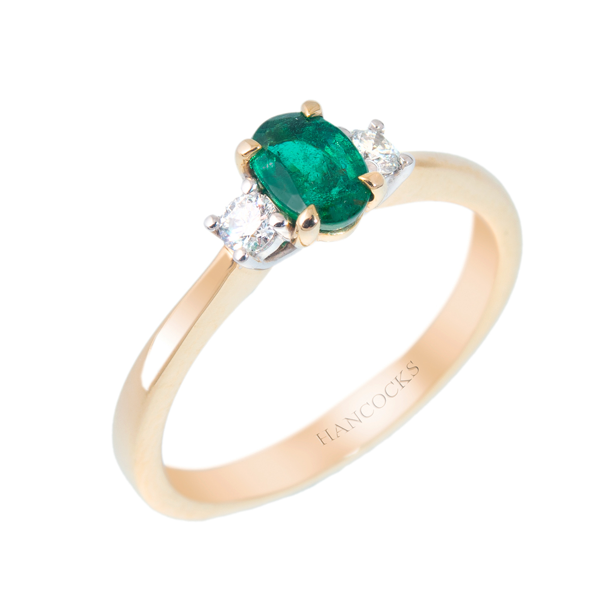 emerald and diamond 3-stone ring in yellow gold