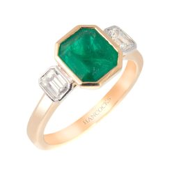 emerald and diamond 3-stone ring rubbed over setting