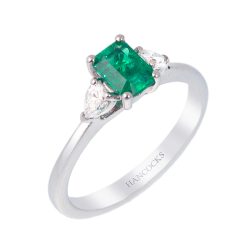 emerald and pear cut diamond three stone ring in platinum