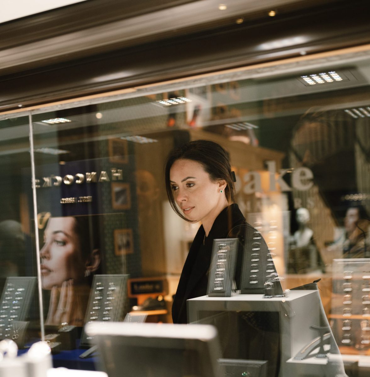 Woman looking at the jewellery at Hancocks Jewellers from the outside
