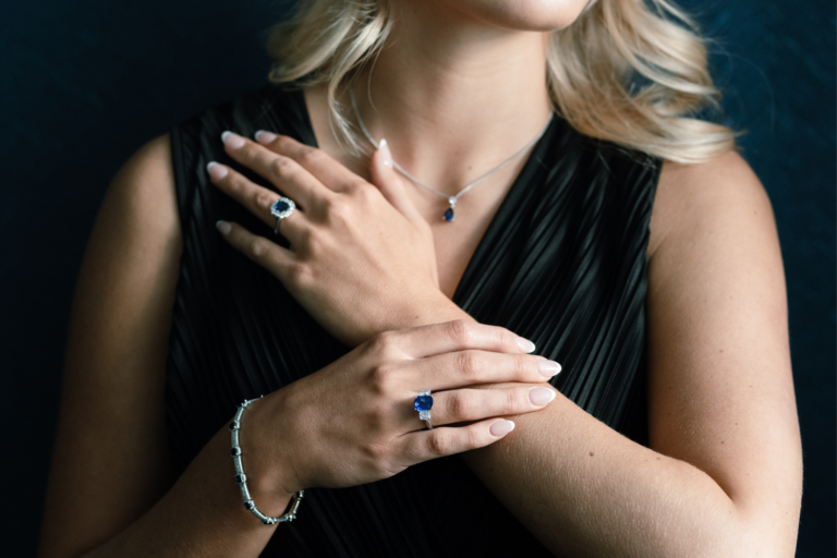 Sapphire and Diamond Rings posed with two hands crossing each other