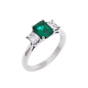 Emerald cut diamond and emerald ring