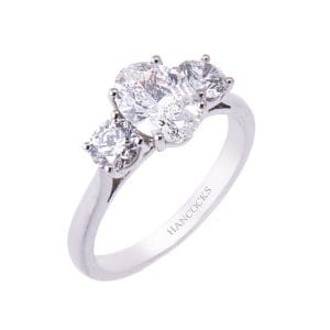 certificated oval cut diamond 3 stone ring in platinum HA 12
