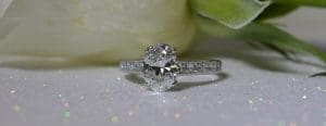 oval-cut-diamond-with-diamond-set-shoulders